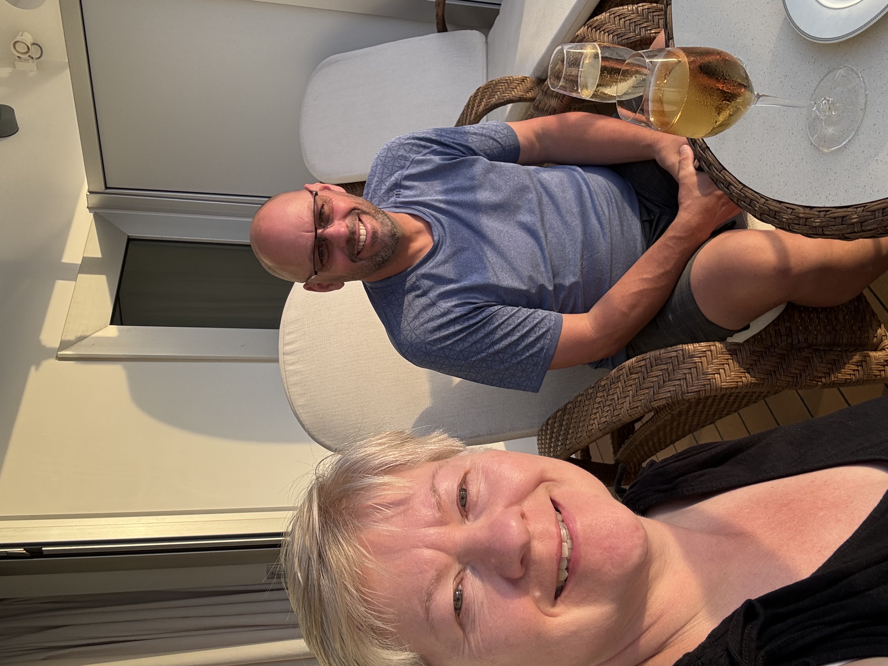 Helen King and her husband enjoying champagne aboard a Regent cruise