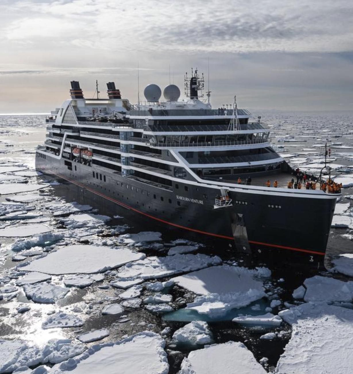 Seabourn Venture expedition ship navigating sea ice in Antarctica