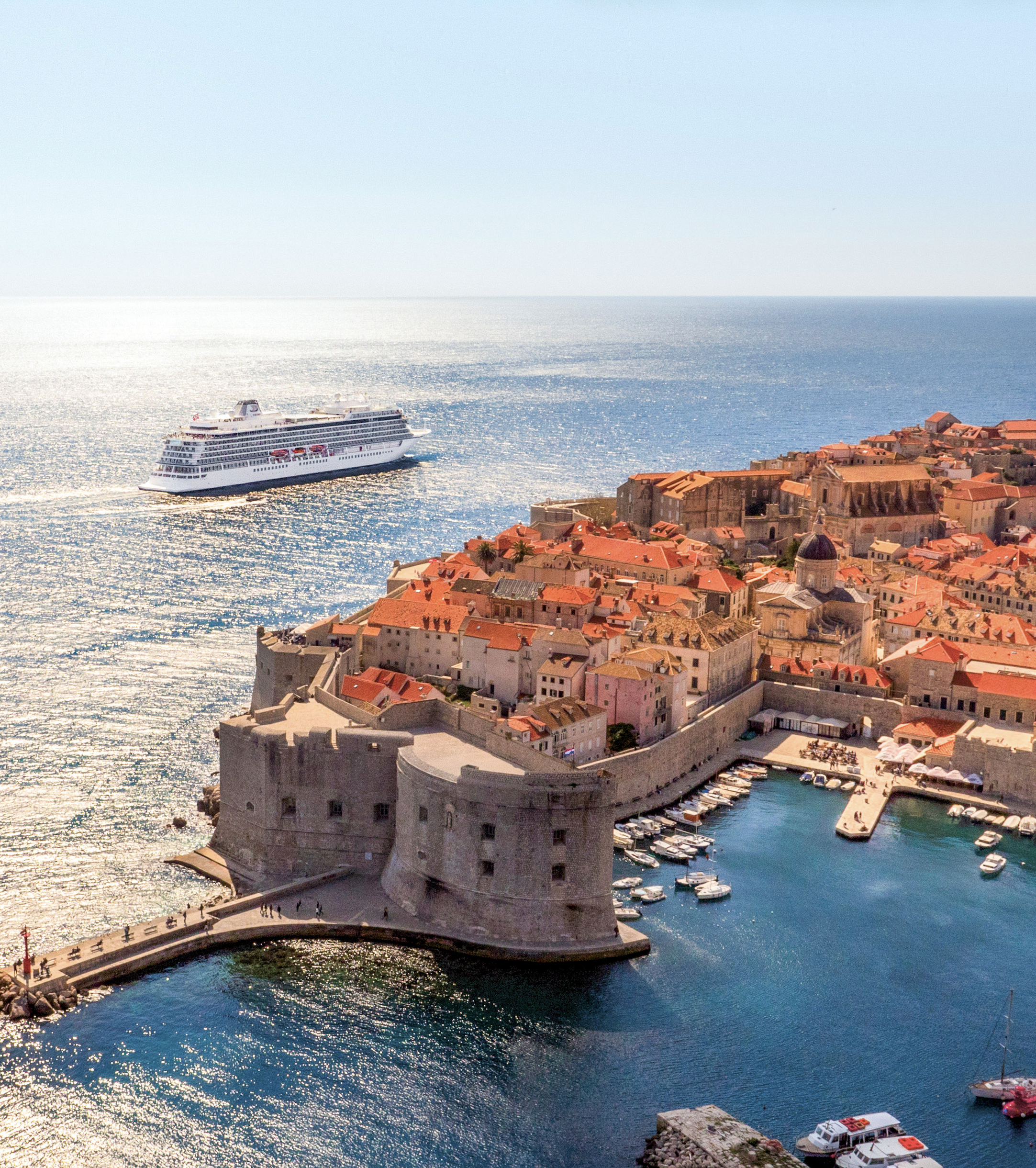 Viking Ocean ship sailing beside Dubrovnik's historic walled city