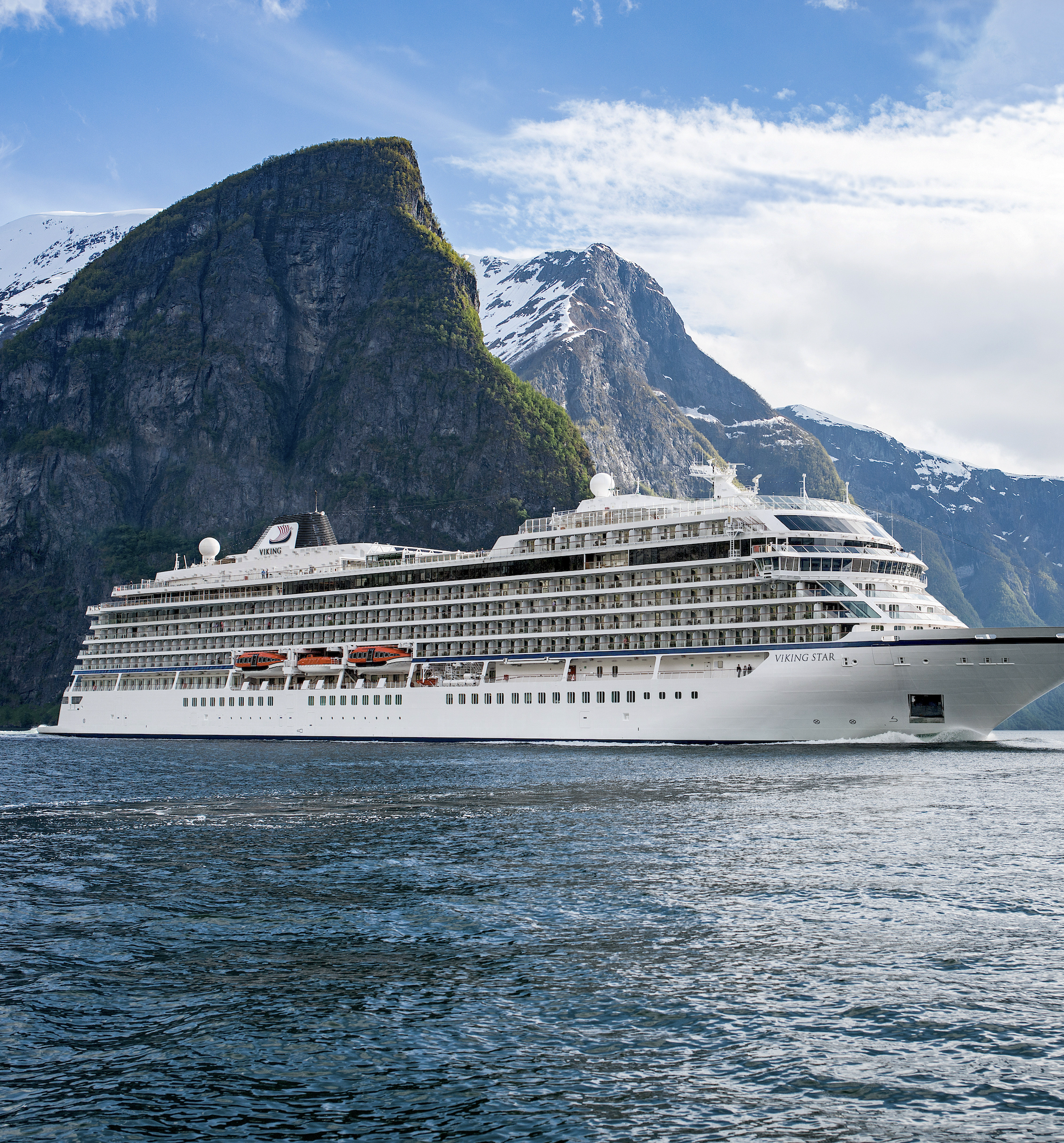 Viking Ocean ship sailing through a Norwegian fjord